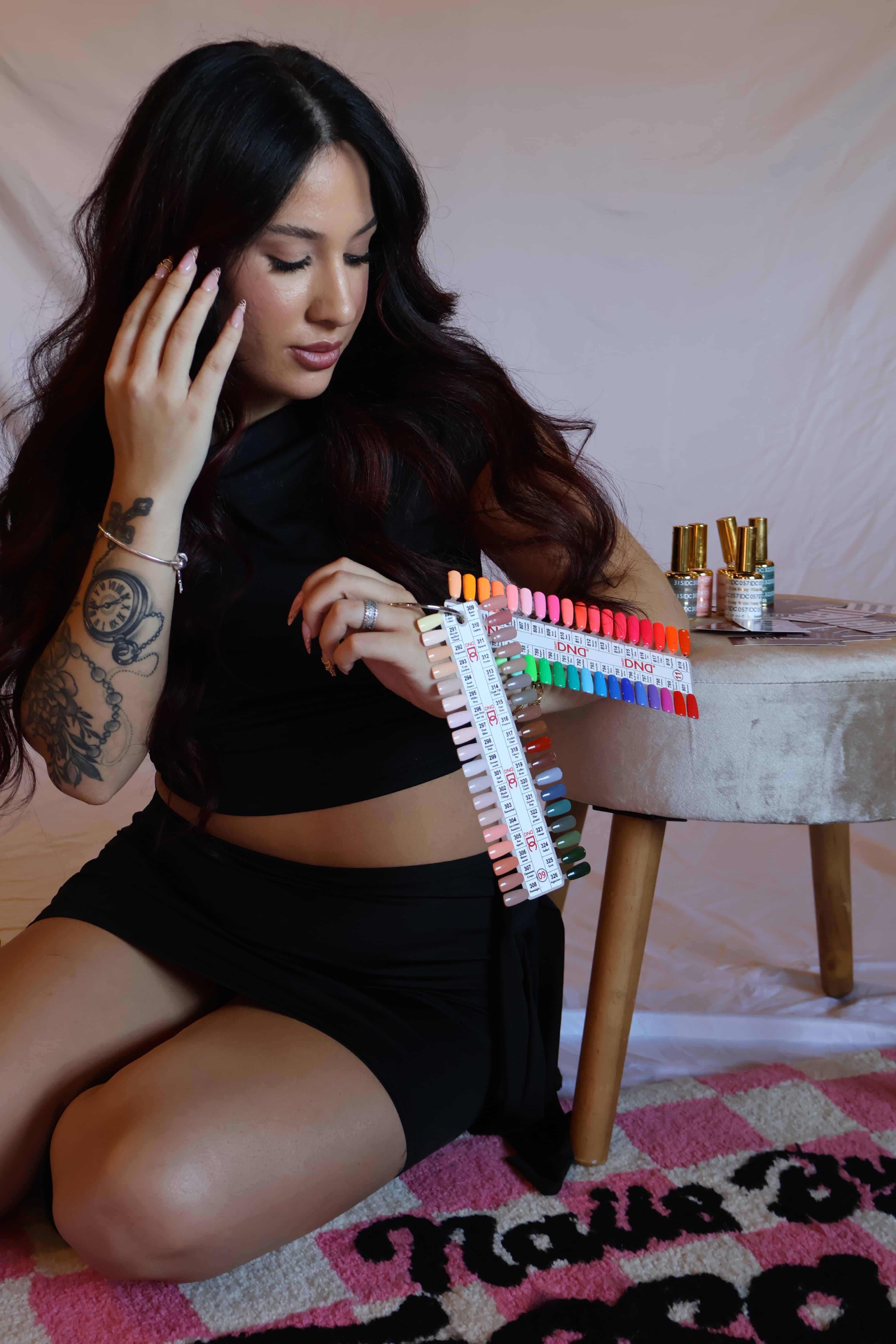 Tessa Burney with her nail color swatch display in the studio