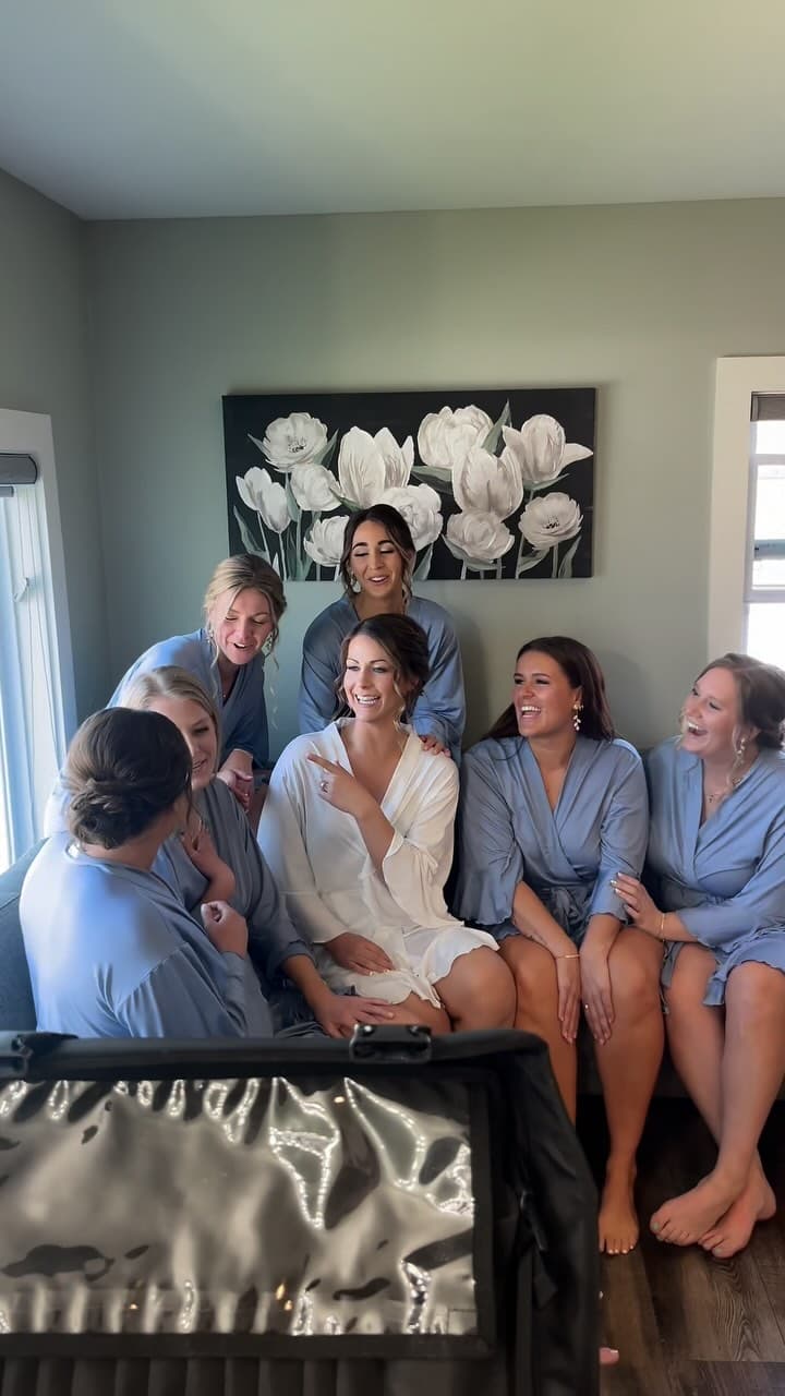 Bride and bridesmaids in matching robes on the wedding morning