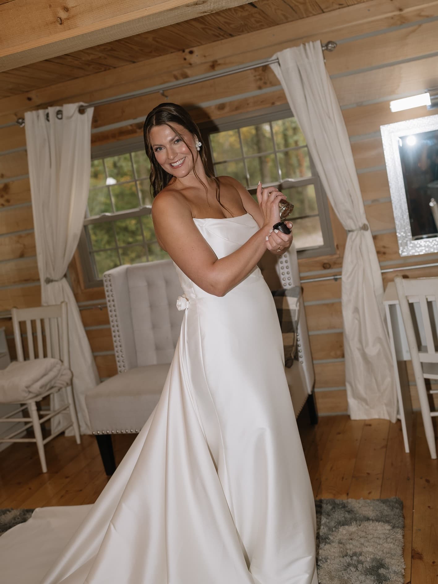 Bride getting ready in a satin robe, bridal beauty by Resilient Glam Studio