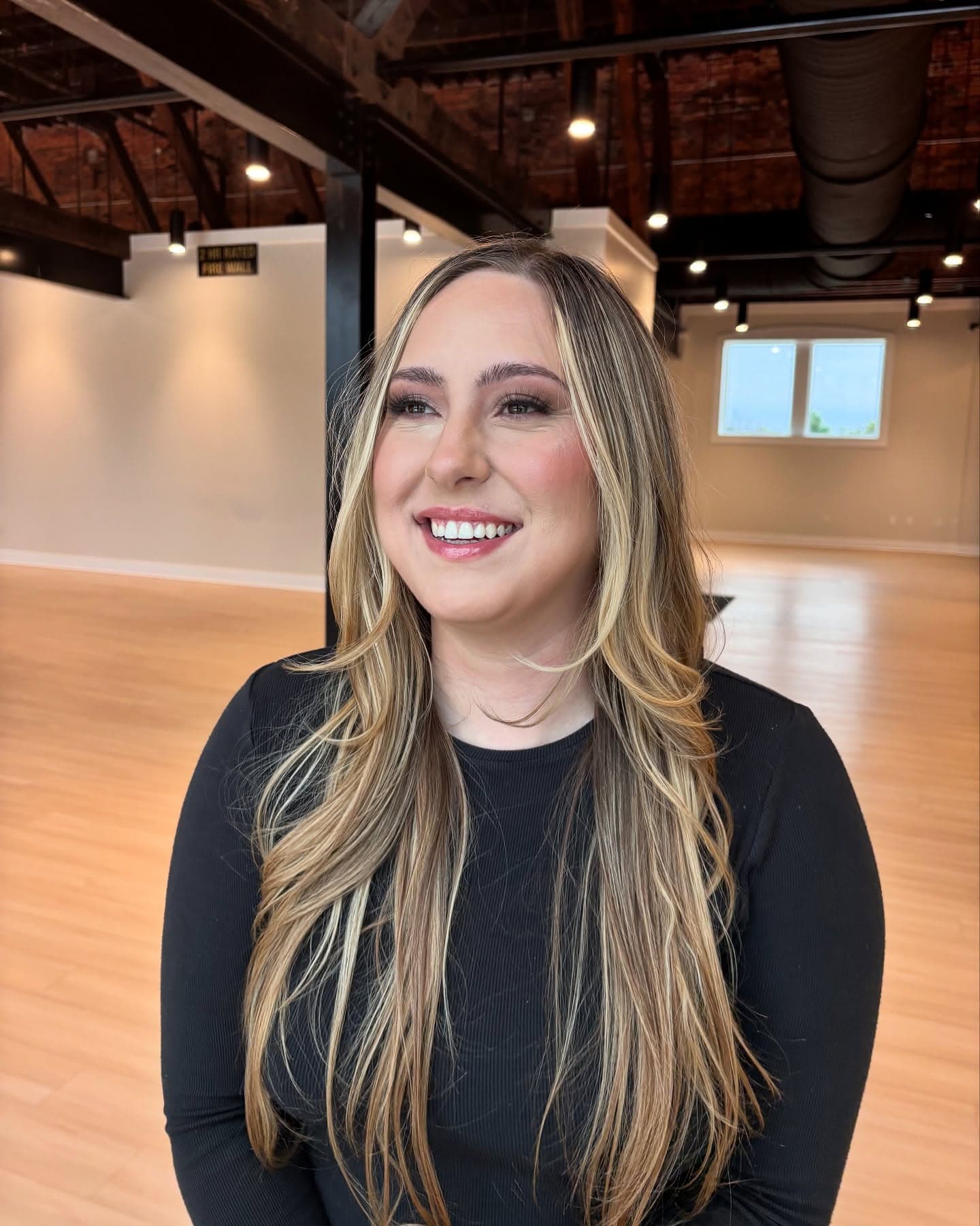Full glam makeup look in a bright studio space