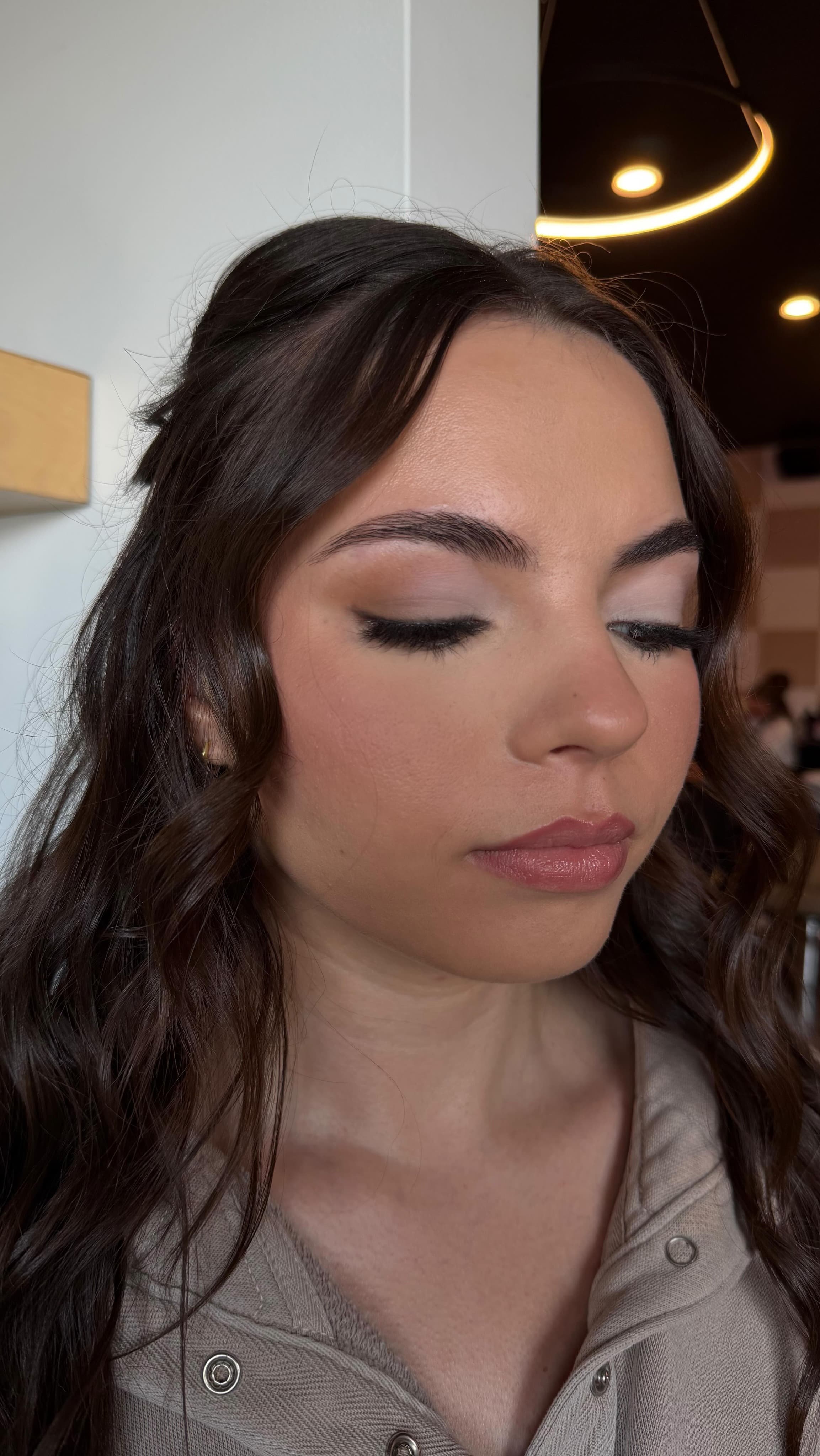 Close-up detail of a soft glam eye and lip makeup application